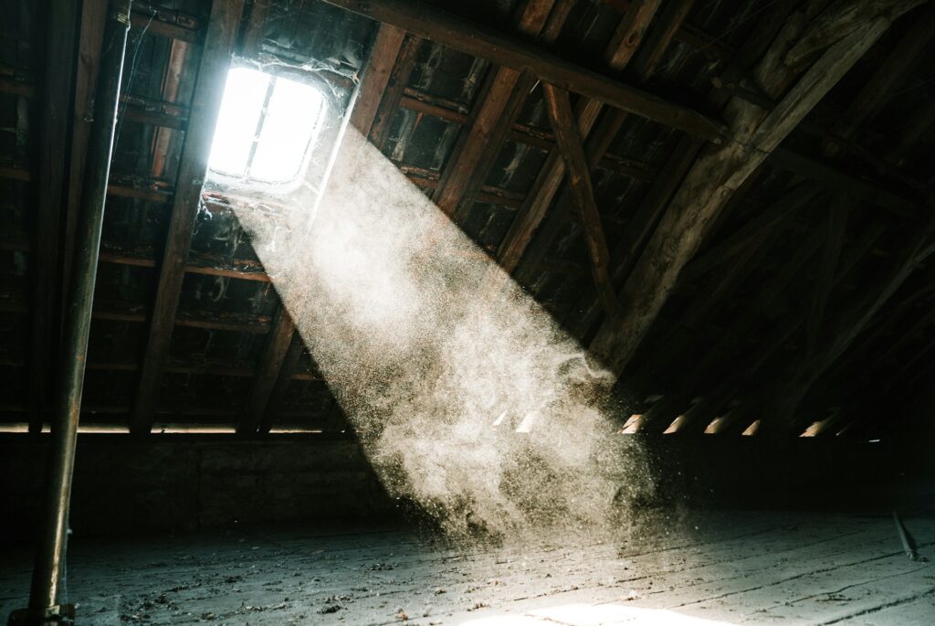 Historic East Portland home attic interior showing condensation moisture on roof decking with vintage architectural details