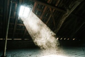 Historic East Portland home attic interior showing condensation moisture on roof decking with vintage architectural details