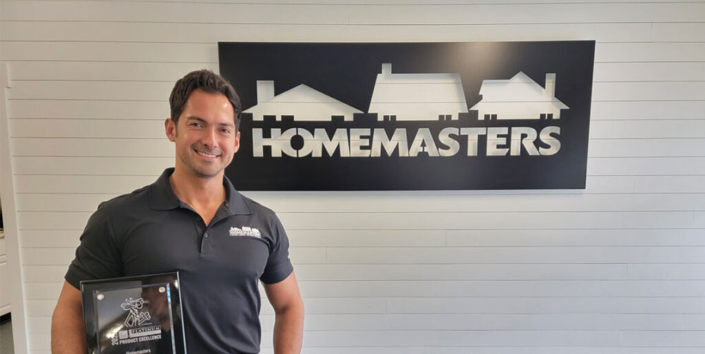 Commercial roofing crew inspecting TPO flat roof on a Salem Oregon commercial building in spring