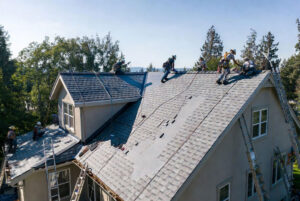 HOMEMASTERS Eugene roofing crew completing a roof replacement on a Lane County Oregon home in summer 2026