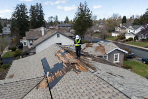 HOMEMASTERS Salem roofing inspector documenting storm damage on a Salem Oregon home for an insurance claim