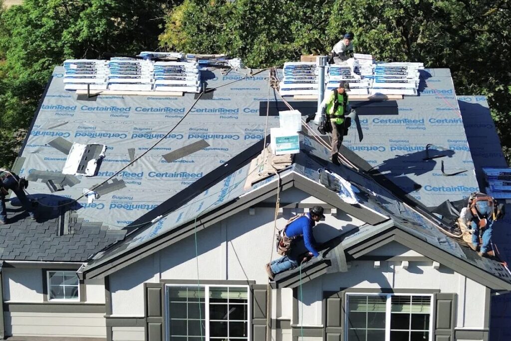 HOMEMASTERS Salem crew completing an architectural shingle roof replacement on a Mid-Willamette Valley home in late summer