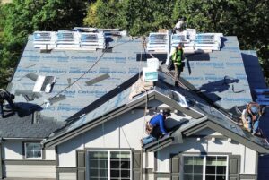 HOMEMASTERS Salem crew completing an architectural shingle roof replacement on a Mid-Willamette Valley home in late summer