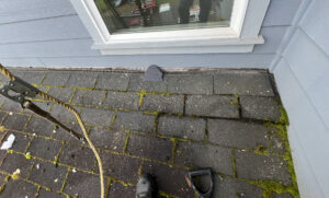 Roof on a home in Salmon Creek, WA showing weathering consistent with an aging asphalt shingle system