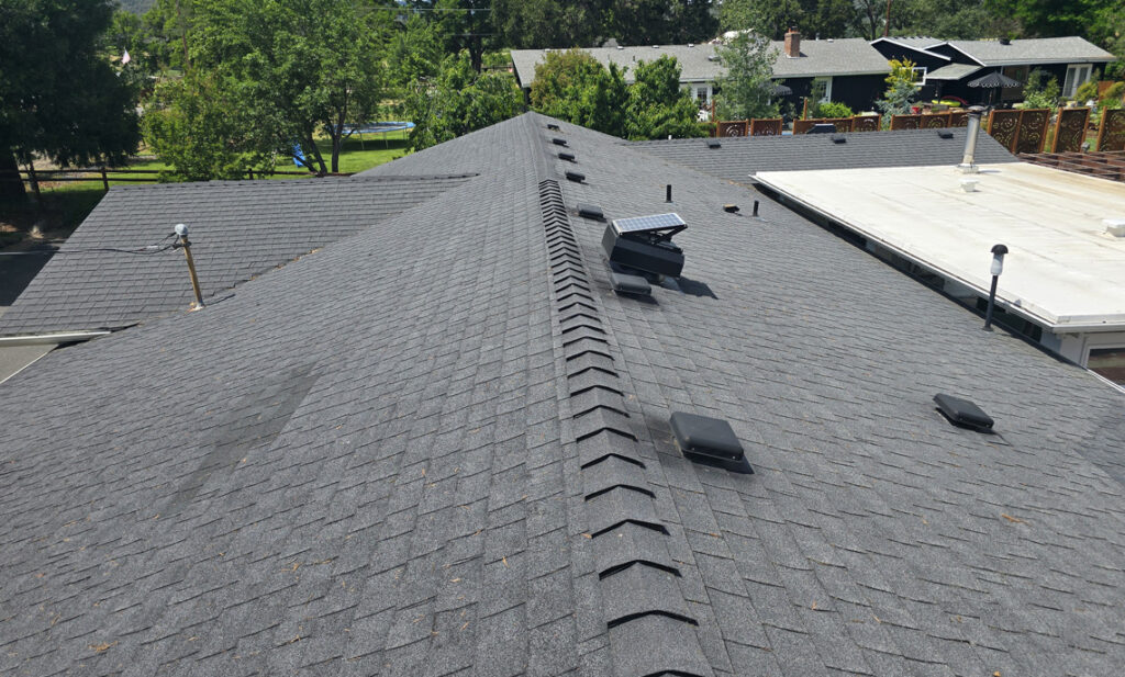 Ridge vent installed along the peak of a residential roof in Milwaukie, Oregon
