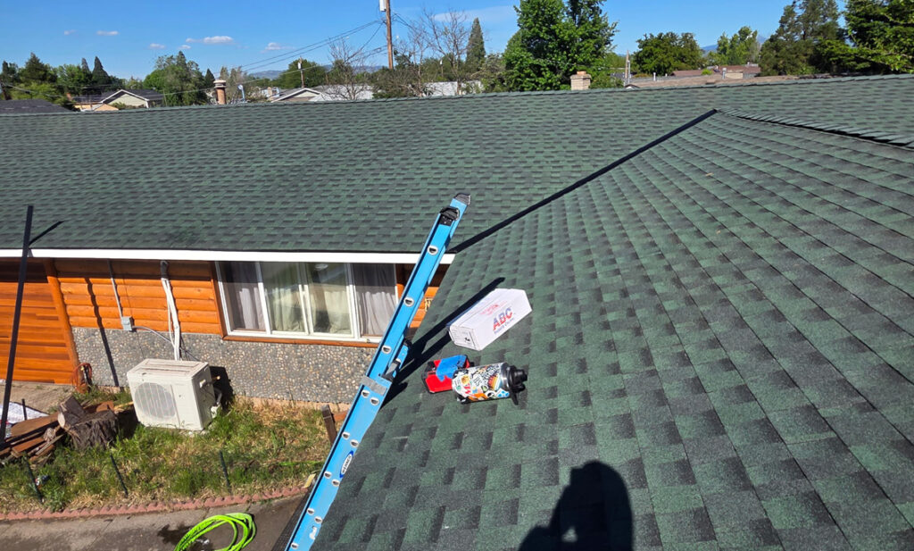 Ridge cap and flashing detail on a newly completed roof in Prineville, Oregon