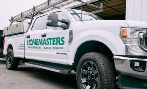 Conifer needles collected in a roof valley and gutter, fall roof maintenance by HOMEMASTERS Eugene for Pleasant Hill