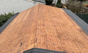 Exposed plywood roof decking with ice and water shield at the eaves during repair, storm damage roof repair for Veneta
