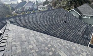 New architectural shingle roof with continuous ridge vent and sealed pipe boots, winter roof prep for Sunriver homes